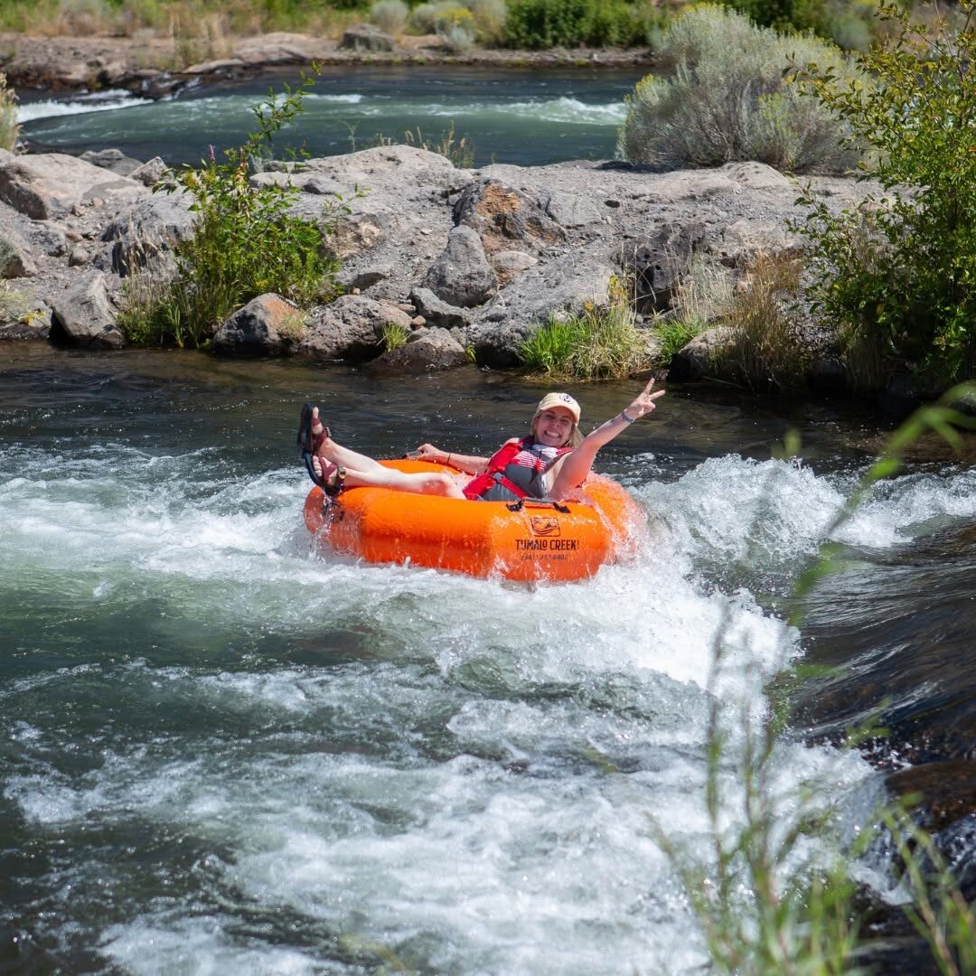 Tubing down the Deschutes river on a sunny day